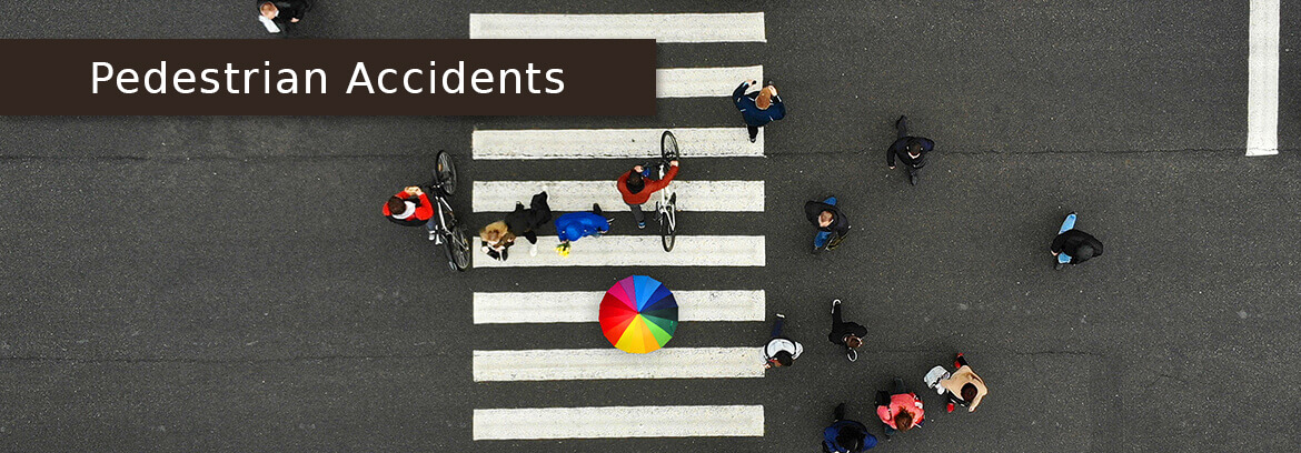 Slip & Falls Personal Injury Cases - Law Offices of Brian Larsen road crossing with caption Pedestrian Accidents