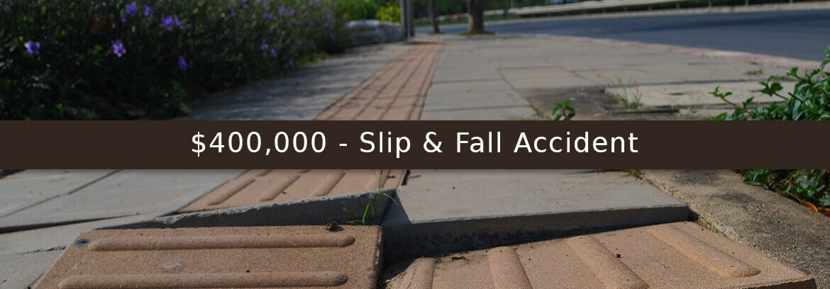 $400,000 - Slip & Fall Accident sidewalk uprooted representing slif and fall case